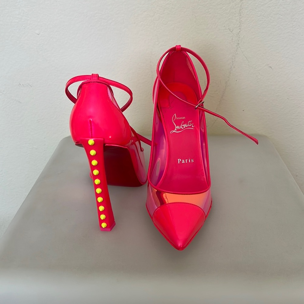 Christian Louboutin hot pink iridescent pump with neon yellow studs.